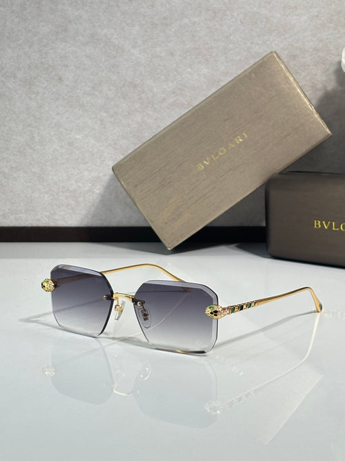 Bvlgari glasses, gold metal rectangular frames with tinted clear lenses and jeweled temples