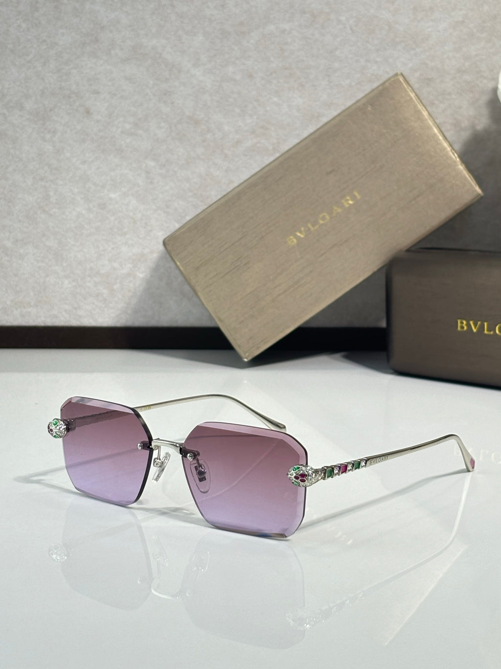 Bvlgari glasses, gold metal rectangular frames with purple tinted lenses and jeweled temples