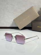 Bvlgari glasses, gold metal rectangular frames with purple tinted lenses and jeweled temples