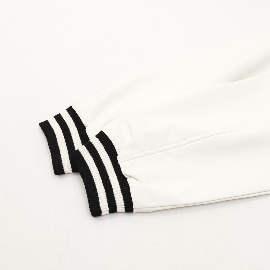Burberry jacket sleeve with black-and-white striped cuff detail