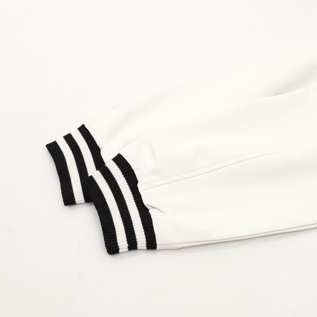 Burberry jacket sleeve with black-and-white striped cuff detail