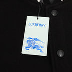 Burberry bomber jacket with hanging brand tag and snap button closure, chest area