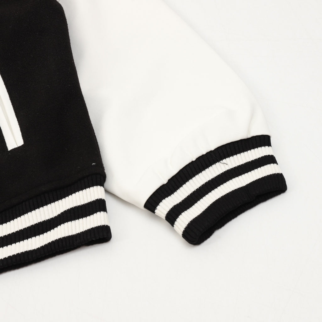 Burberry bomber jacket sleeve cuffs with black-and-white striped ribbing
