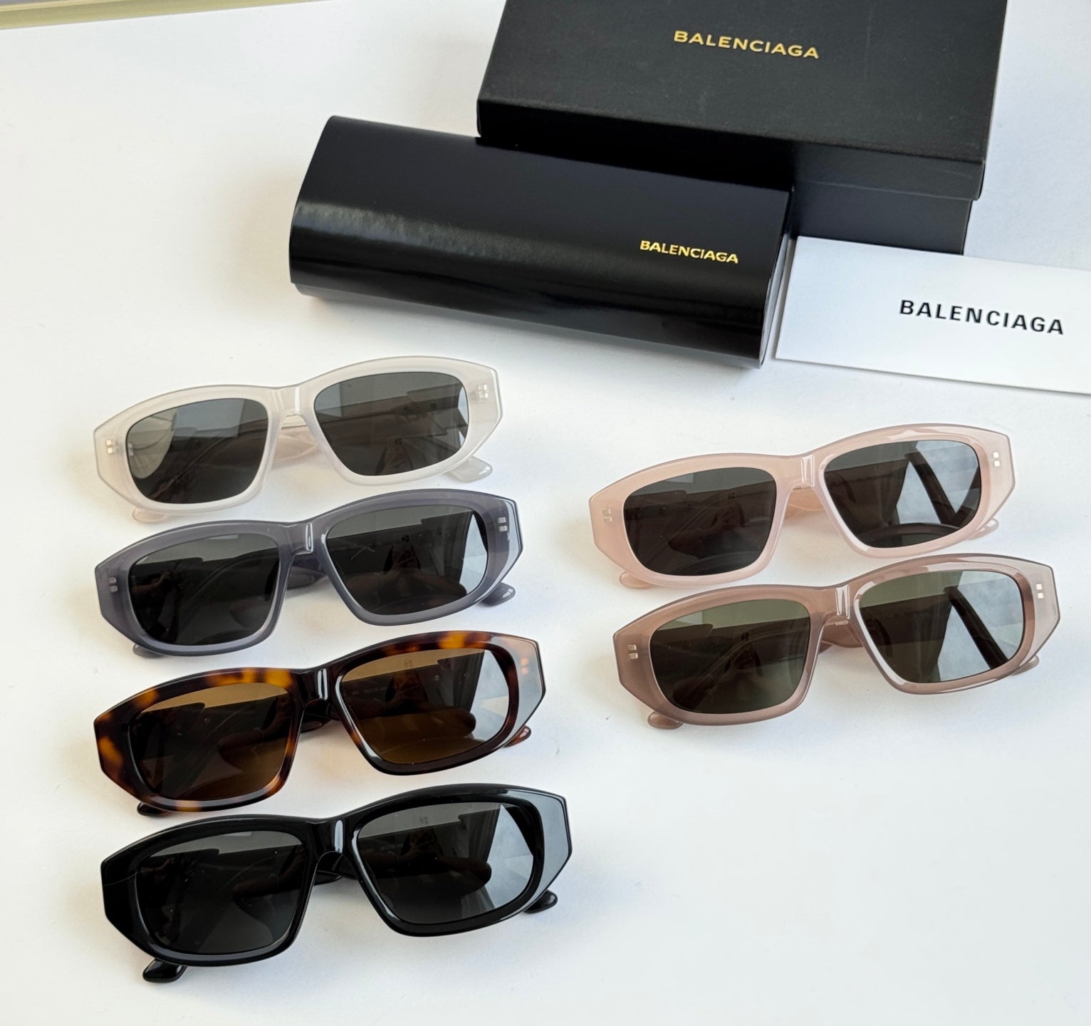 Assorted sunglasses set with dark lenses and Balenciaga logo temples