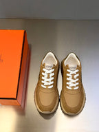 Tan lace-up sneakers with white laces and thick sole, pair view