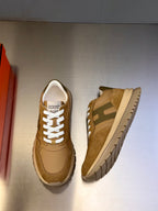 Tan sneakers with white laces and rubber sole, front and side view