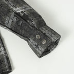Dark gray long-sleeve button-up shirt cuff with buttoned detail