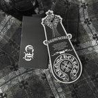 Dark gray button-up shirt packaging label and tag on patterned fabric