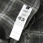 Dark plaid long-sleeve button shirt with size label