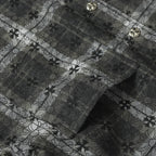 Close-up of dark gray floral-patterned button-up shirt fabric