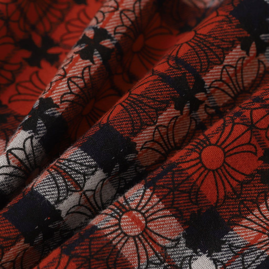Red and black floral plaid fabric with woven texture