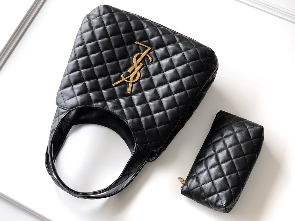 Black quilted tote bag with gold YSL logo and matching mini pouch