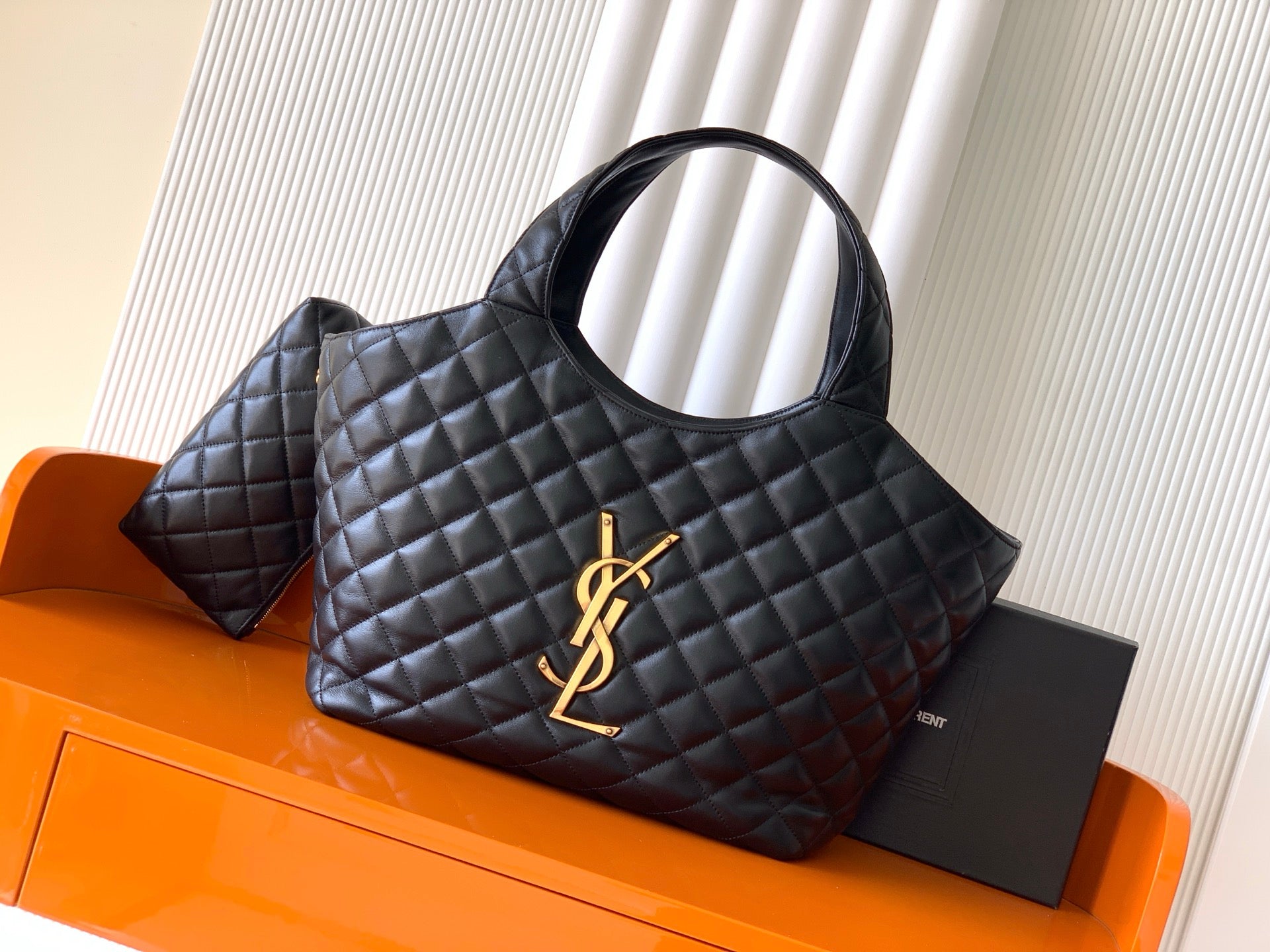 Black quilted leather tote bag with gold YSL logo at front
