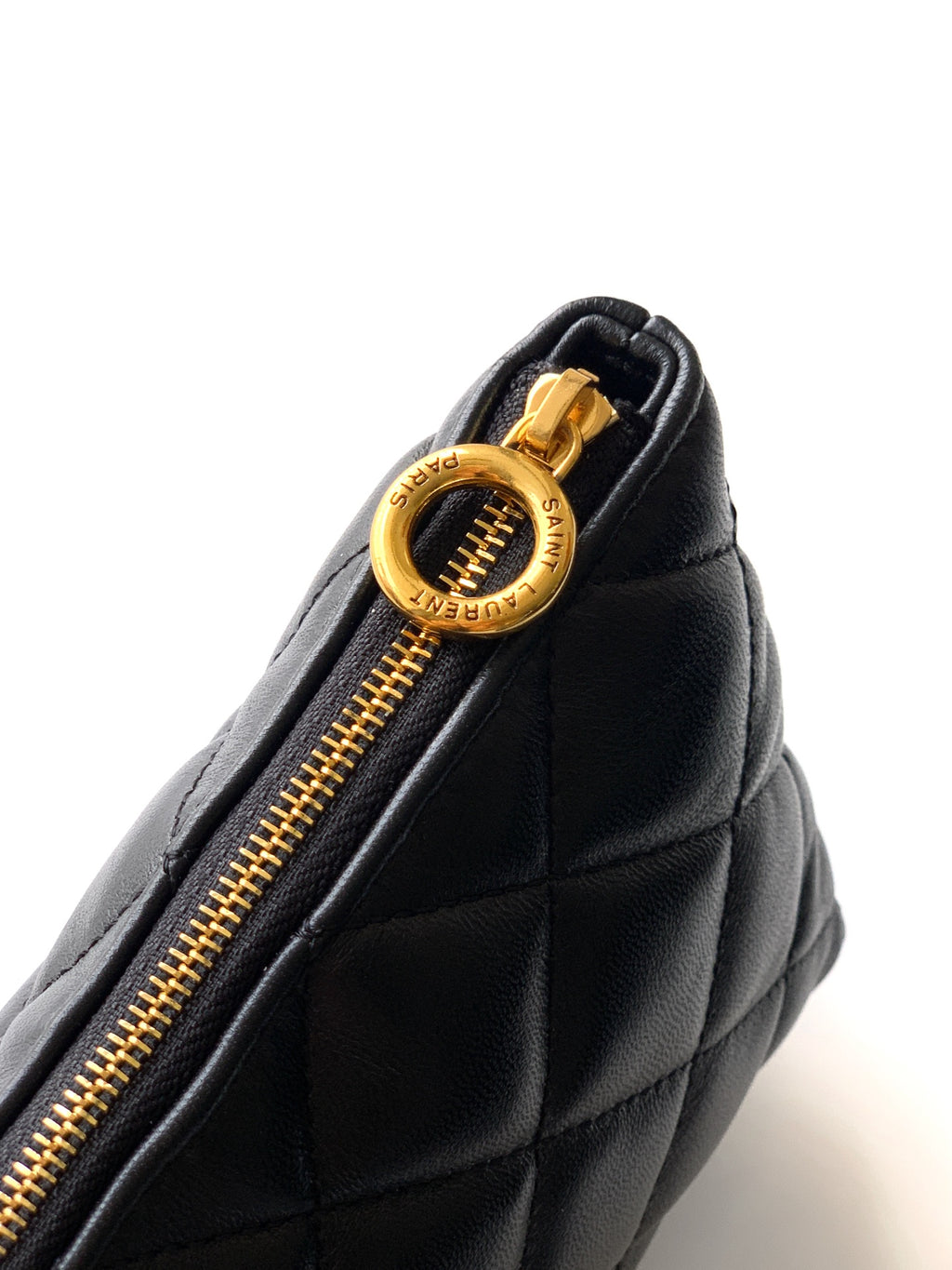 Black quilted bag zipper pull with gold YSL logo charm