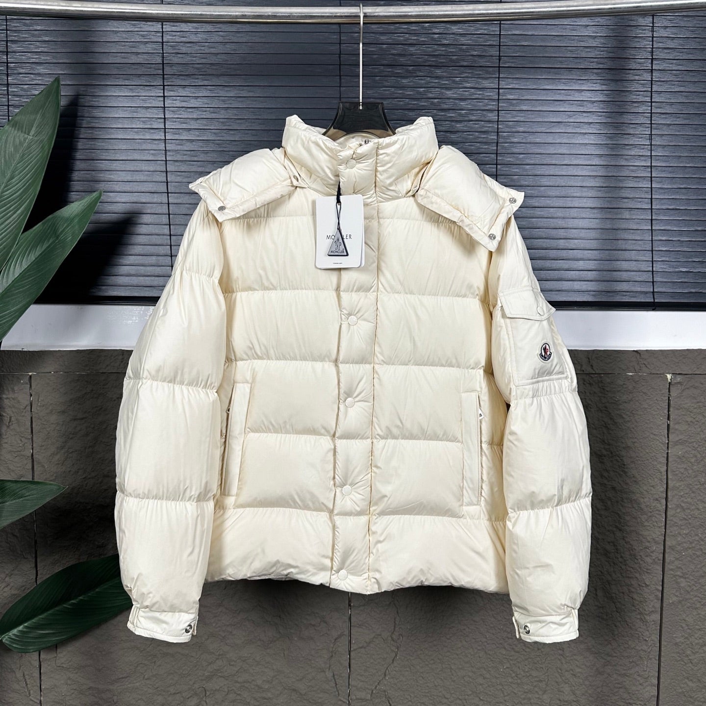 Off-white long puffer jacket with stand collar and front zip