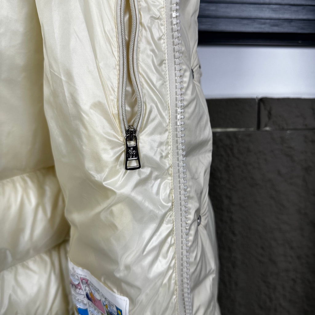 Off-white puffer jacket side with full zipper and snap placket