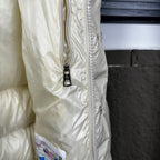 Off-white puffer jacket side with full zipper and snap placket