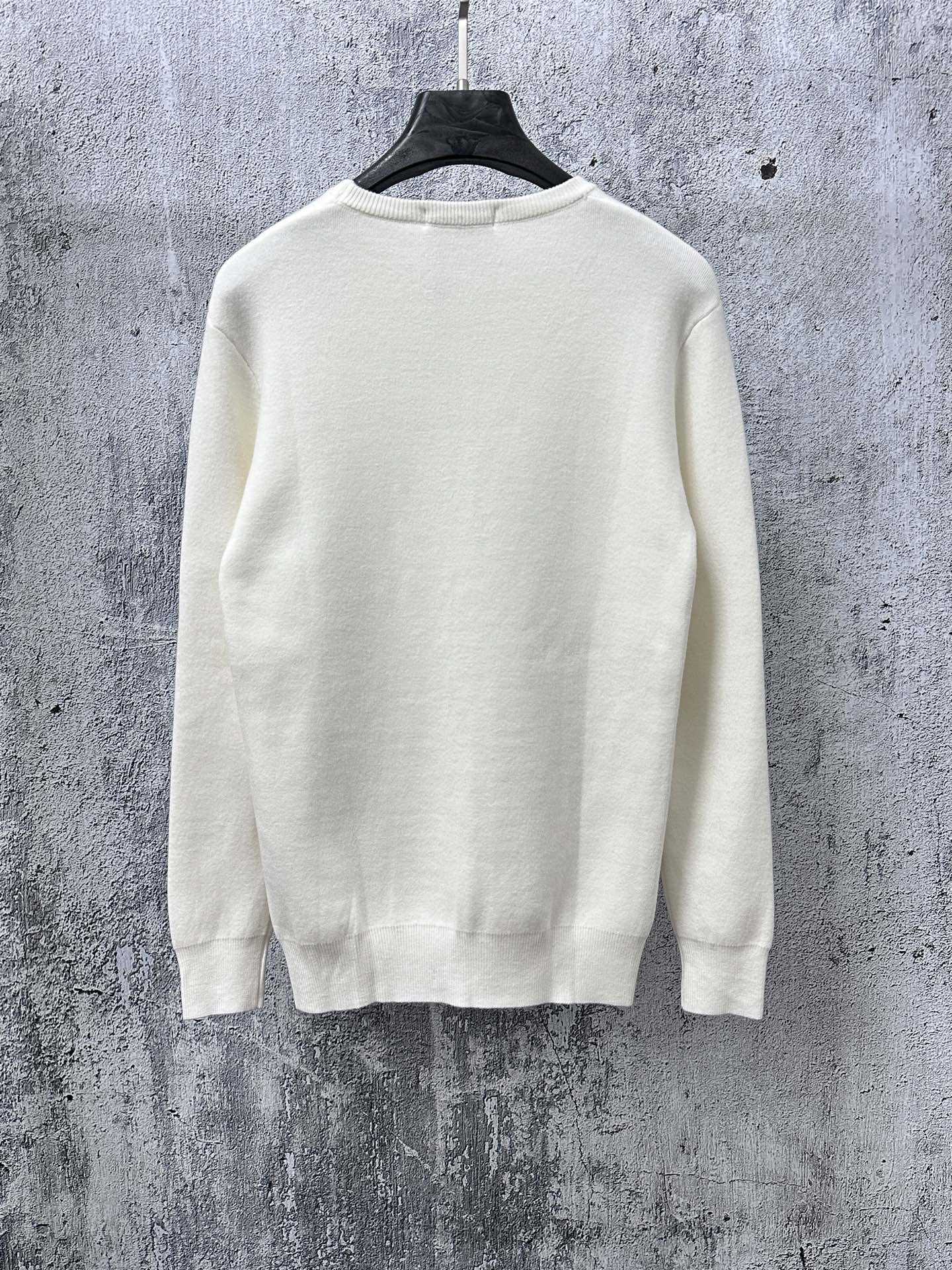 Louis Vuitton crewneck sweater, white knit back view on hanger
