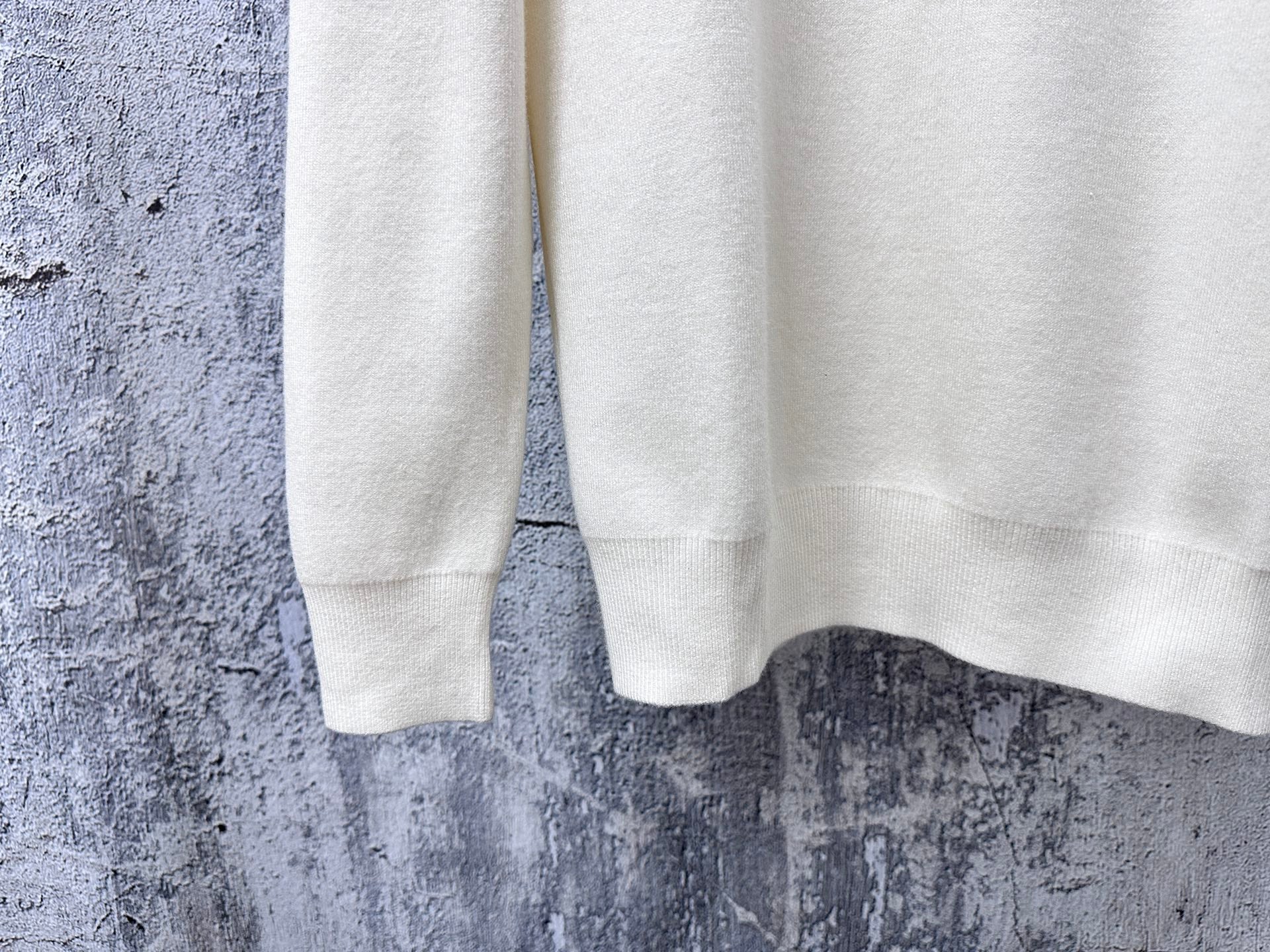 Prada cream sweater sleeve and hem, ribbed cuffs and bottom edge