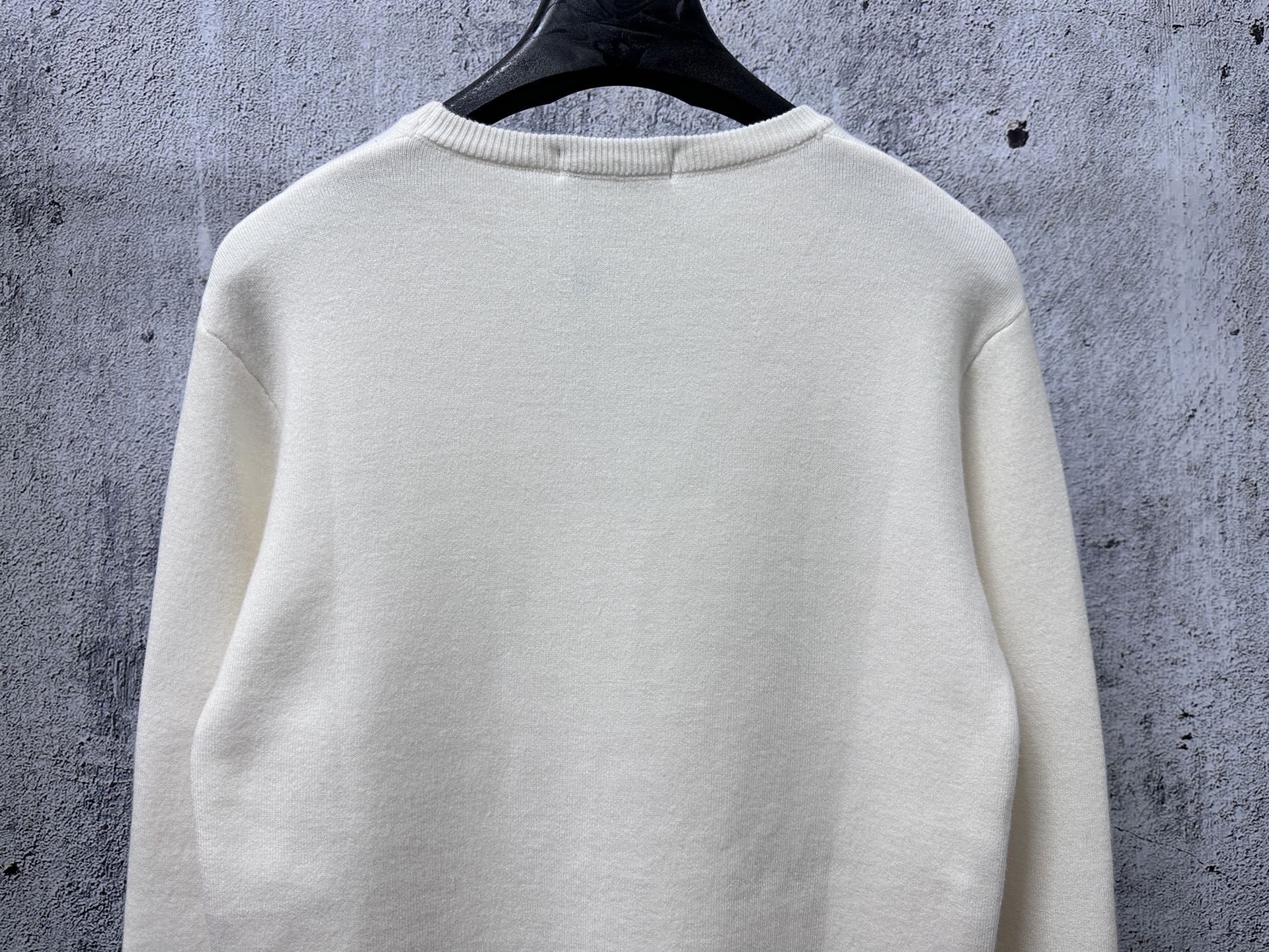 Prada cream long-sleeve sweater back view with ribbed hem and crewneck