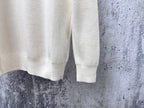 Prada cream sweater lower sleeve and hem with ribbed finish