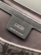 Crossbody bag logo label on leather, dark gray grain with Dior branding