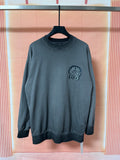 Dark teal long-sleeve sweatshirt with small chest graphic emblem