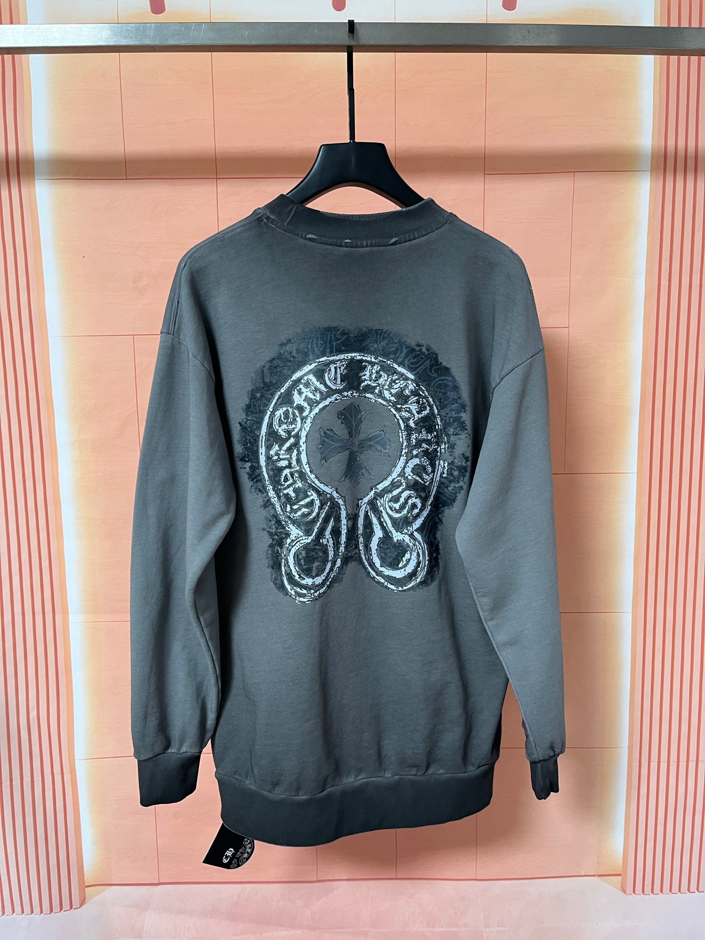 Dark teal long-sleeve sweatshirt with large back graphic emblem