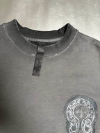 Dark teal sweatshirt with short button placket and small chest emblem