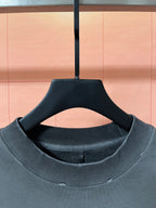 Dark teal ribbed crew neckline on long-sleeve sweatshirt