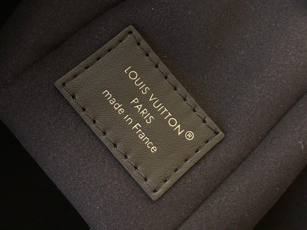 Inside leather label with “LOUIS VUITTON” and “made in France” text