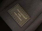 Inside leather label with “LOUIS VUITTON” and “made in France” text