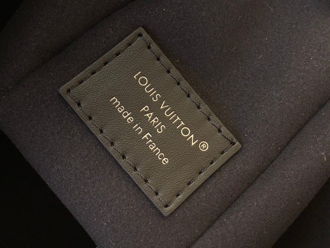 Inside leather label with “LOUIS VUITTON” and “made in France” text