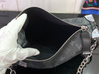 Monogram handbag interior with zip top and silver-tone hardware, open view