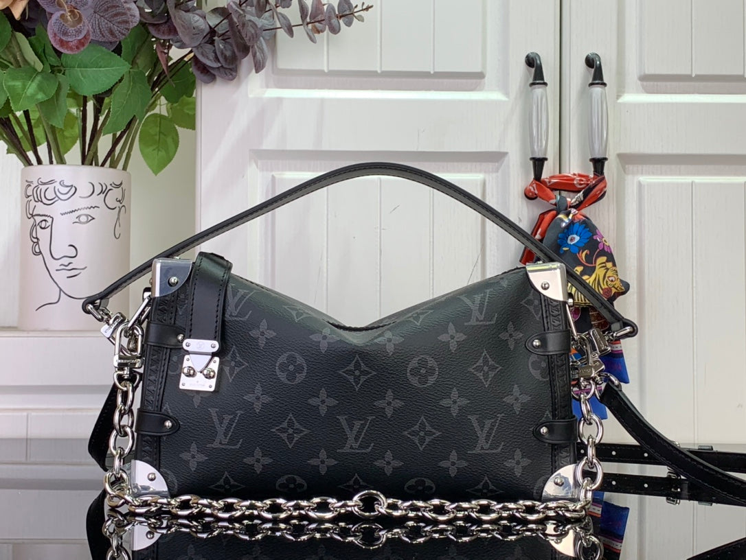 Dark monogram shoulder bag with chain strap and silver-tone hardware, centered front