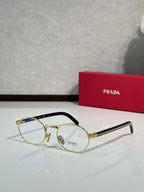 Round eyeglasses with clear lenses, gold frame and black temple arms
