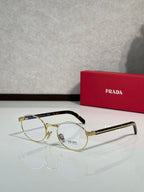 Prada eyeglasses with round clear lenses, gold frame and dark temples