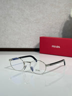 Round eyeglasses with clear lenses, silver frame and dark temple arms