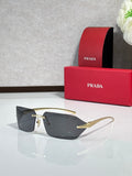 Prada sunglasses with dark gray rectangular lenses and gold-tone temples.