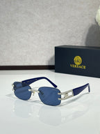 Blue sunglasses with dark blue lenses and silver-tone front with rectangular bridge accents