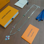 Silver chain charm necklace with multicolor flower pendant and star/heart charms