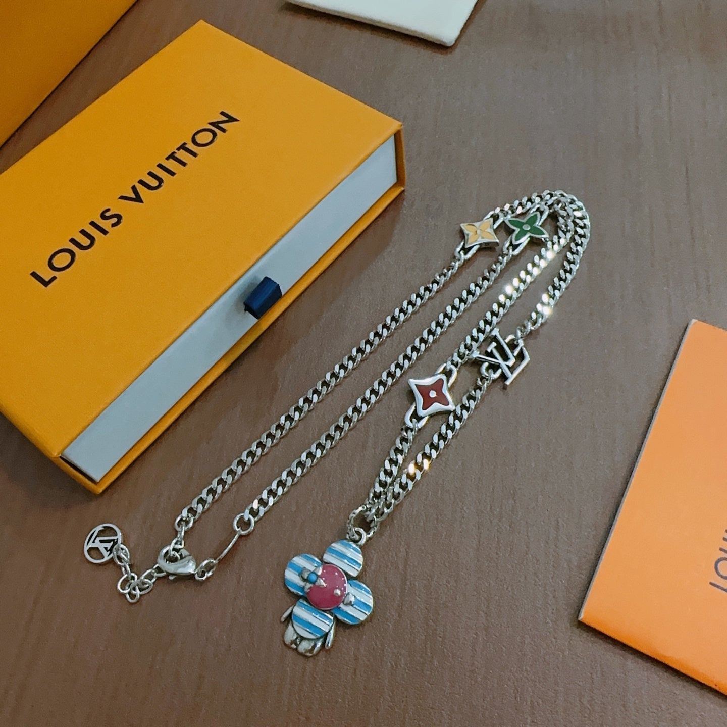 Silver chain charm necklace with enamel flower charm and star/heart pendants