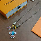 Silver-tone charm necklace with blue robot and multicolor bear charms plus star pendant