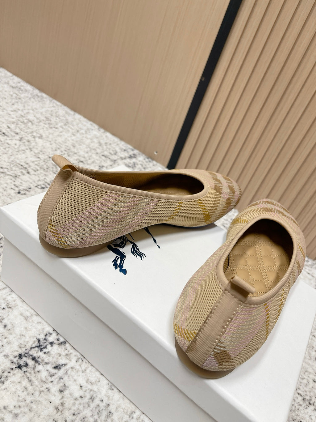 Burberry check-pattern slip-on flats, front and side angles with blue logo on insole
