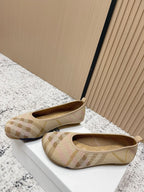 Burberry check-pattern slip-on flats, side view with low heel