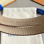 Louis Vuitton leather bracelet interior with 'MADE IN ITALY' stamp and stitched edge.
