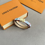 Louis Vuitton bracelet with multicolor monogram print and gold clasp, cream leather interior.