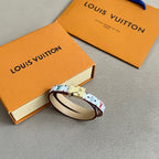 Louis Vuitton bracelet with multicolor print, cream leather edge, and gold clasp hardware.