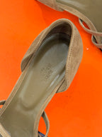 Close-up of beige suede heeled sandal toe and interior lining.