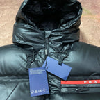 Long hooded puffer jacket hood and zip front with hanging tags and PRADA